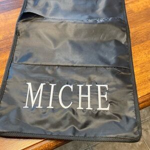 Miche hanging shell storage, 13 spaces- one is torn.